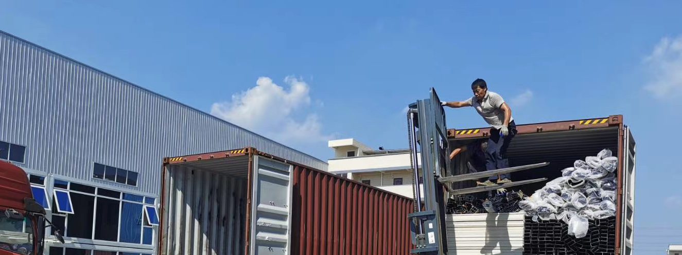 Container being loaded with packed panels